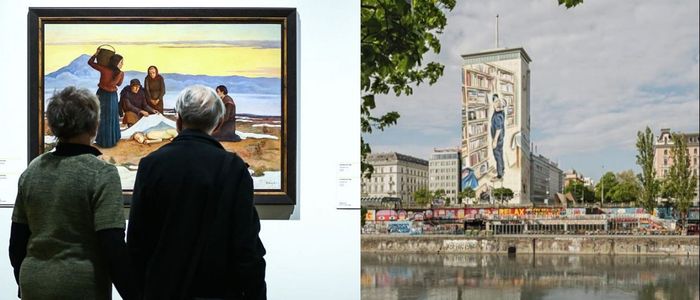 An elderly couple views artwork in a museum while a massive mural covers a riverside building, highlighting Polandâ€™s cultural preservation efforts.